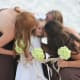 Very simple hydrangeas bring a bright spot of pastel green to the mocha brown dresses.