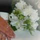 White lily, Carnations, and Ornithogalum (Star of Bethlehem) bring variation of a pure white theme.