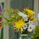 Some of the flowers at my wedding. My arrangements were meant to look "thrown together" for my casual, natural theme - but you can make them any way you like.