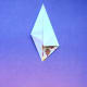 Fold sides toward center at opposite point, as shown.