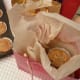 First, place greaseproof paper in you bag. Add muffins.