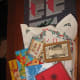 Various Christmas books displayed in a tray with vintage linen.
