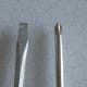 Flat head screw driver on the left, Phillips head screw driver on the right.