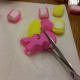 Cut the bottom of the marshmallow peeps so it appears to be hiding in the grass.