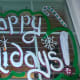 Happy holidays painted on a residential window set.