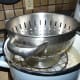 The colander provided extra weight to keep the eggs under water.