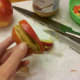 Spread peanut butter on apple slices.