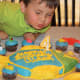 The birthday boy blowing out his candle!