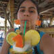 Tropical drink in a pineapple topped with fruit!