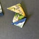 E) Fold bottom tip up to meet the center