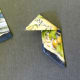 D) Fold top tip down at center fold