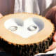 Natural wood with engraved heart to hold the wedding rings.