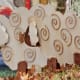 These wooden sheep are displayed around the panel and give it dimension. A very clever idea!