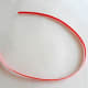 Take a red strip of quilling paper.