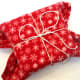 Using a blanket with creative ideas for gift wrapping.