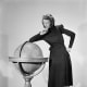 A model wearing a black woollen Utility Atrima dress in 1943 (public domain)