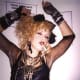A contemporary model showing off Madonna's early fashion style from the mid-1980s.