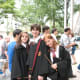 This is an "authentic" Hogwarts uniform look, including books, wands, and spectacles!