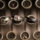 His and her wedding rings on typewriter keys