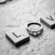 Black and white photography of LOVE with a diamond engagement ring