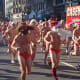 Jesus Santa (or Hippie Santa) meets regular Santa in the Santa Speedo Run in Boston.
