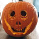 And this is my pumpkin after I carved it into a scary, goofy, grinning jack-o-lantern. Boo!