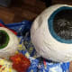 Once the iris is painted, paint the interior circle black to create a pupil.