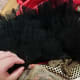 Sew the ruffles onto the clown costume
