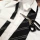 Cut the tie to fit the Clark Kent costume.