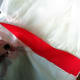 Add red ribbon around the waist.