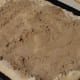 The dough rolled out with cinnamon and brown sugar
