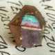 Garnet is January's birthstone. Pictured here is a naturally irridescent andradite garnet.