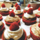 German chocolate cupcakes with vanilla frosting and fresh red raspberries