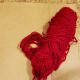 You will need a piece of cardboard and yarn to create yarn heart ornaments for your decoration.