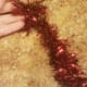 Begin wrapping garland strand around the wire.