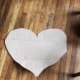 Cut a large heart out of your cardboard. It doesn't have to be perfect. The cards will cover up any straight lines.