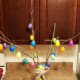 Add a decorative ribbon to finish your tree. If you want to create a fancy bow, check out the tutorial below. Display your Easter tree on a mantle or as a table centerpiece.