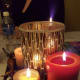 Painted acorns, gourds and groupings of candles create light and an attractive centerpiece.