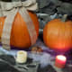 Burlap strands or ribbons make a wonderful bow on pumpkins. Add a few candles and your centerpiece is simple yet beautiful.