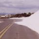 White sand encroaching upon the road.