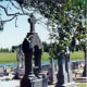 The cemetery outside St. Cyril & Methodius Catholic Church ~ Some stately monuments for this place and time.