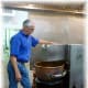 Kenneth Wilkinson explaining how sugar is melted in this large copper pot...part of the truffle making process.