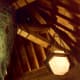 Looking up at the ceiling beams and handcrafted lighting fixtures