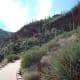 At the top of the hill to the right of the clouds is a second cliff dwelling. It must be hiked to, but appointments can be made to go up with a ranger.