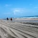 Riding horses along the shoreline at Frisco, Cape Hatteras National Seashore, NC Outer Banks
