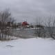 A winter view of the Lake Superior shore looking toward the U. S. Coast Guard Marquette Harbor Lighthouse, preserved by the Marquette Maritime Museum