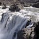 At the very edge of the falls, water flow is still strong.