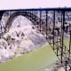 The thin line of dirt at the lower bridge support is the original depth of the canyon before the Bonneville flood.