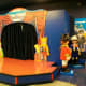 The stage is used for activities and games.