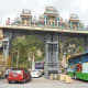 Cars and tourist buses entering the carpark to the Batu Caves.